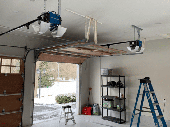 Commercial garage door technician completing an installation
