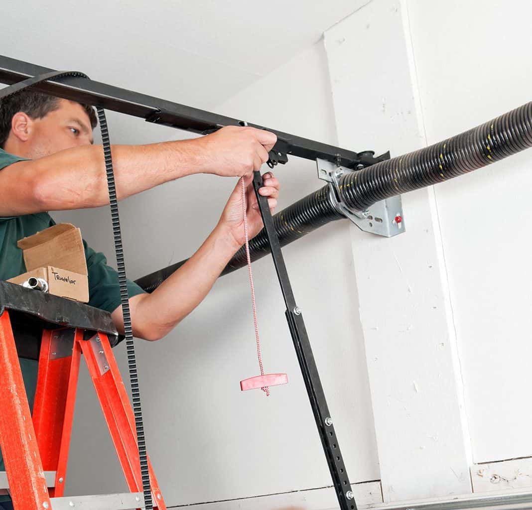 Garage door installation project with professional technicians